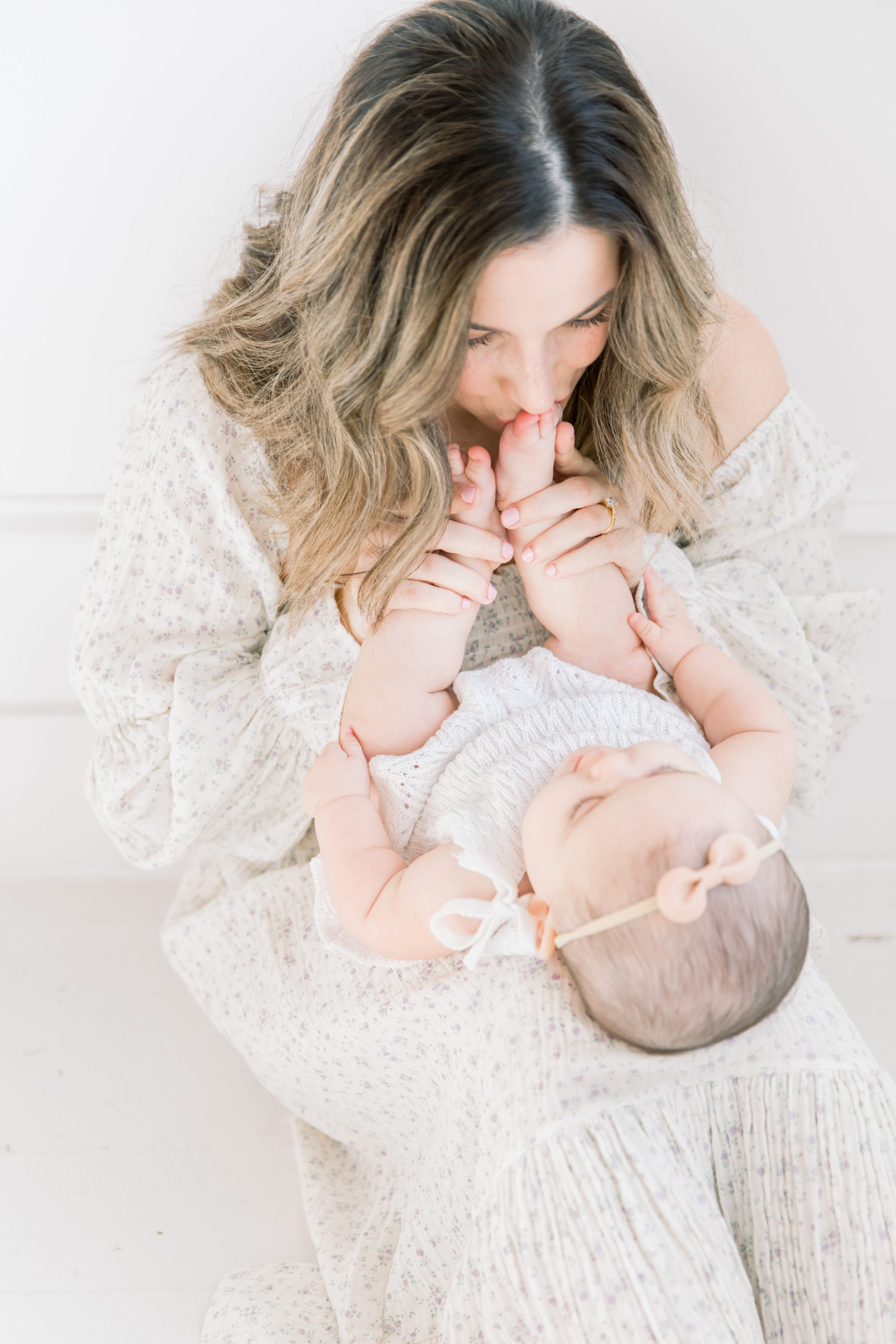 Mama and baby daughter in a studio motherhood photography session. Charlotte Baby Photography by Katie Petrick Photography.