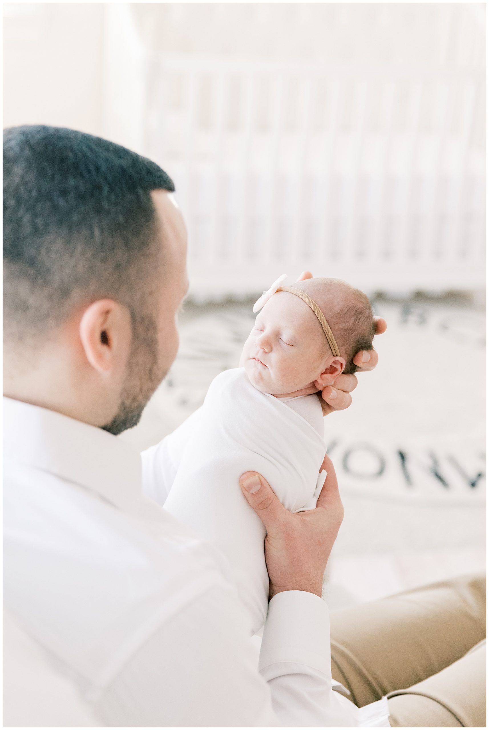 dad holing newborn baby during lifetsyle newborn session - Katie Petrick Photography